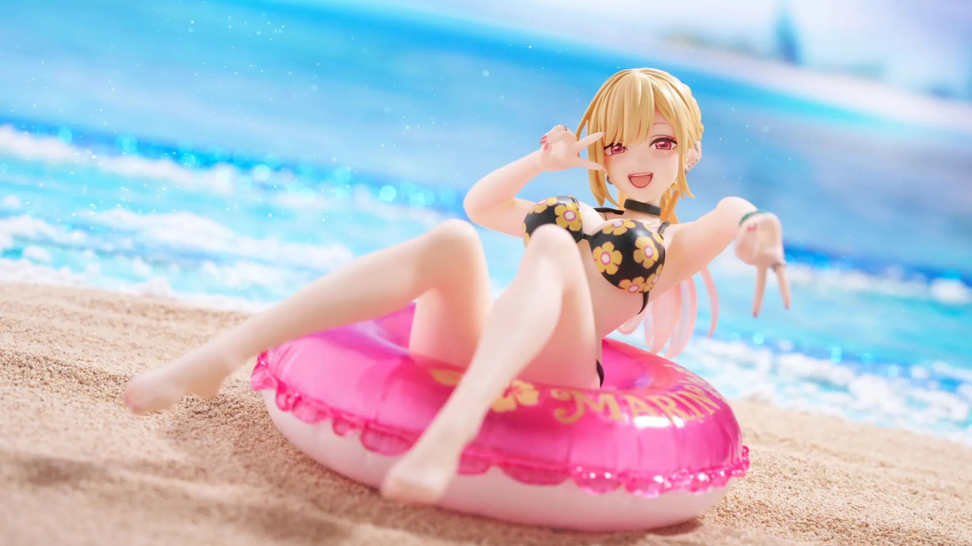 my dress up darling prize figures blog My Dress-Up Darling Marin Kitagawa swimsuit figure sitting on a pink inner tube at the beach
