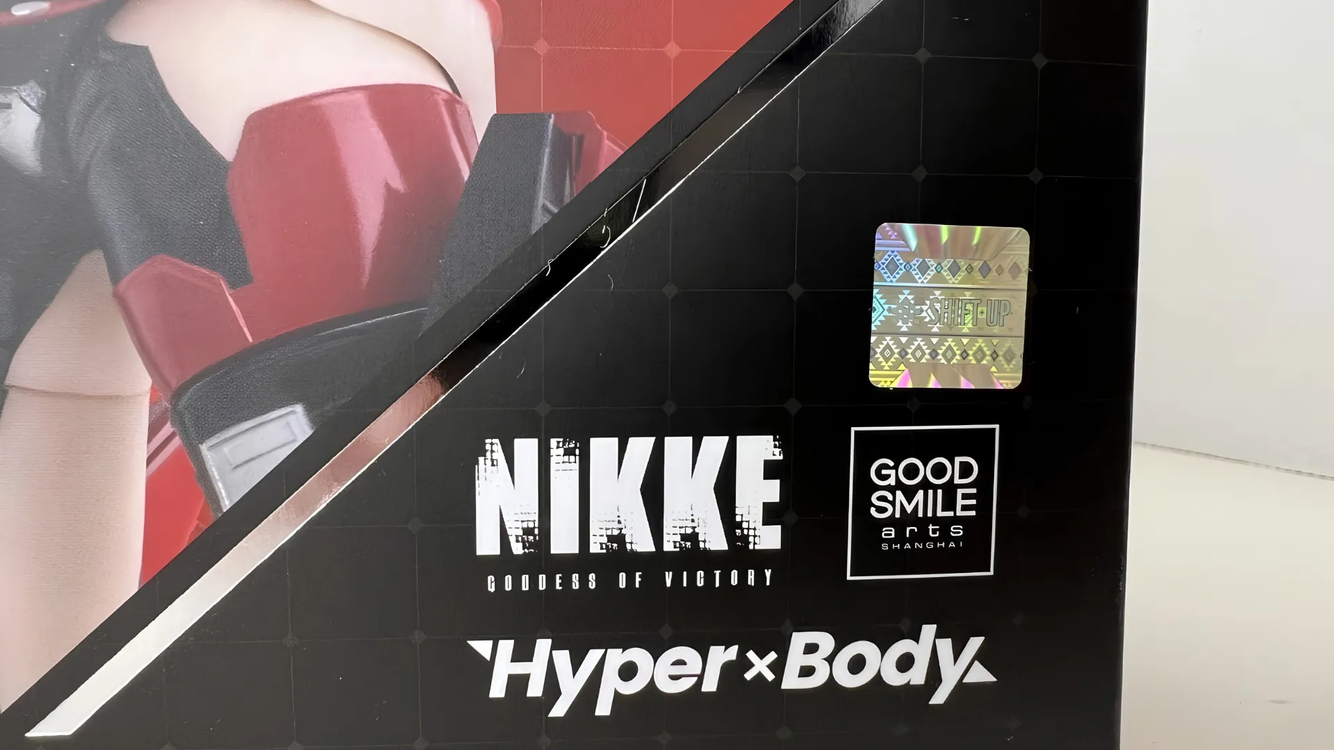 anime figure official holographic authenticity seal blog Goddess of Victory: Nikke Hyper Body action figure box showing Good Smile Arts Shanghai logo and Shift Up hologram sticker